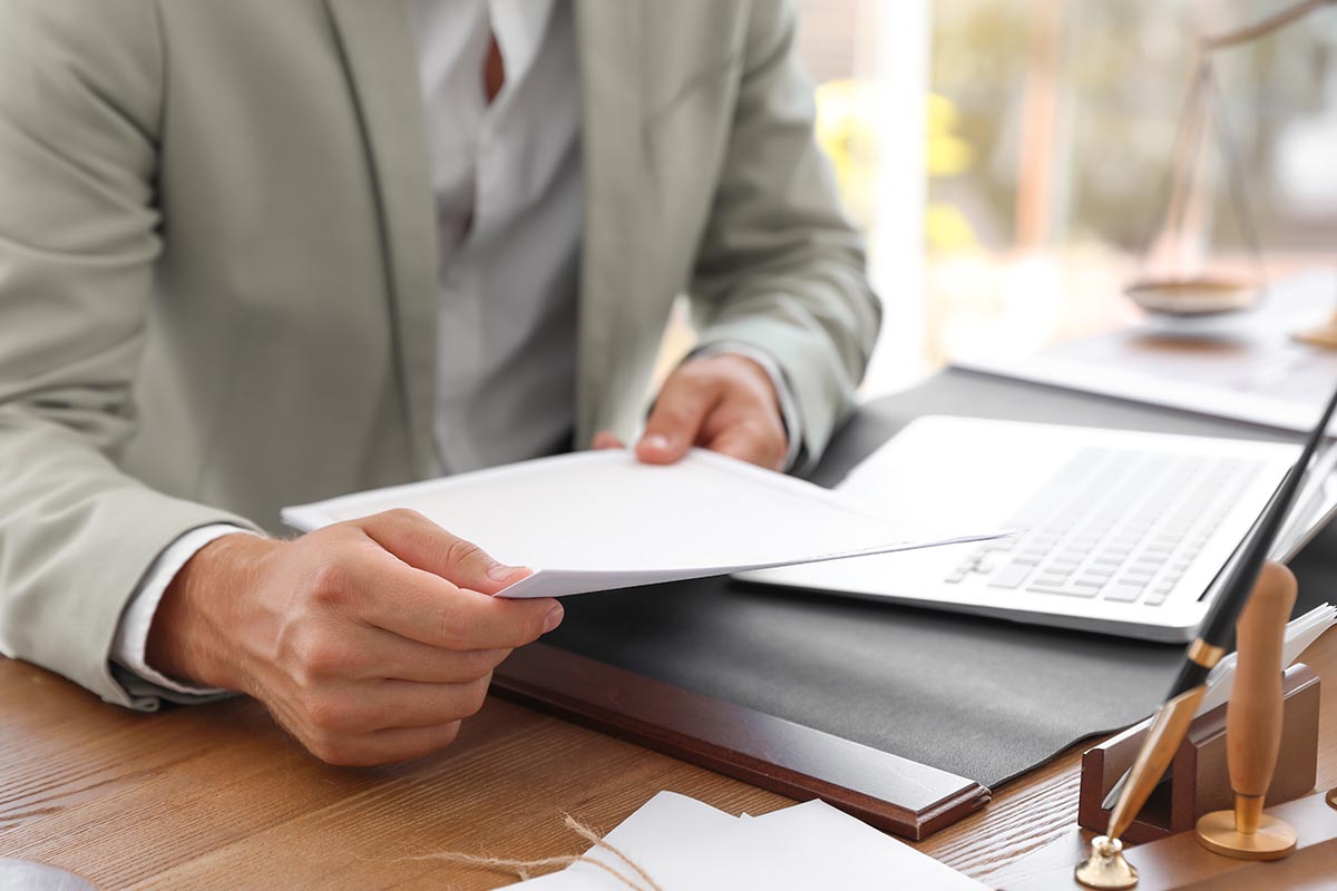 a certified counselor holds papers close to the camera