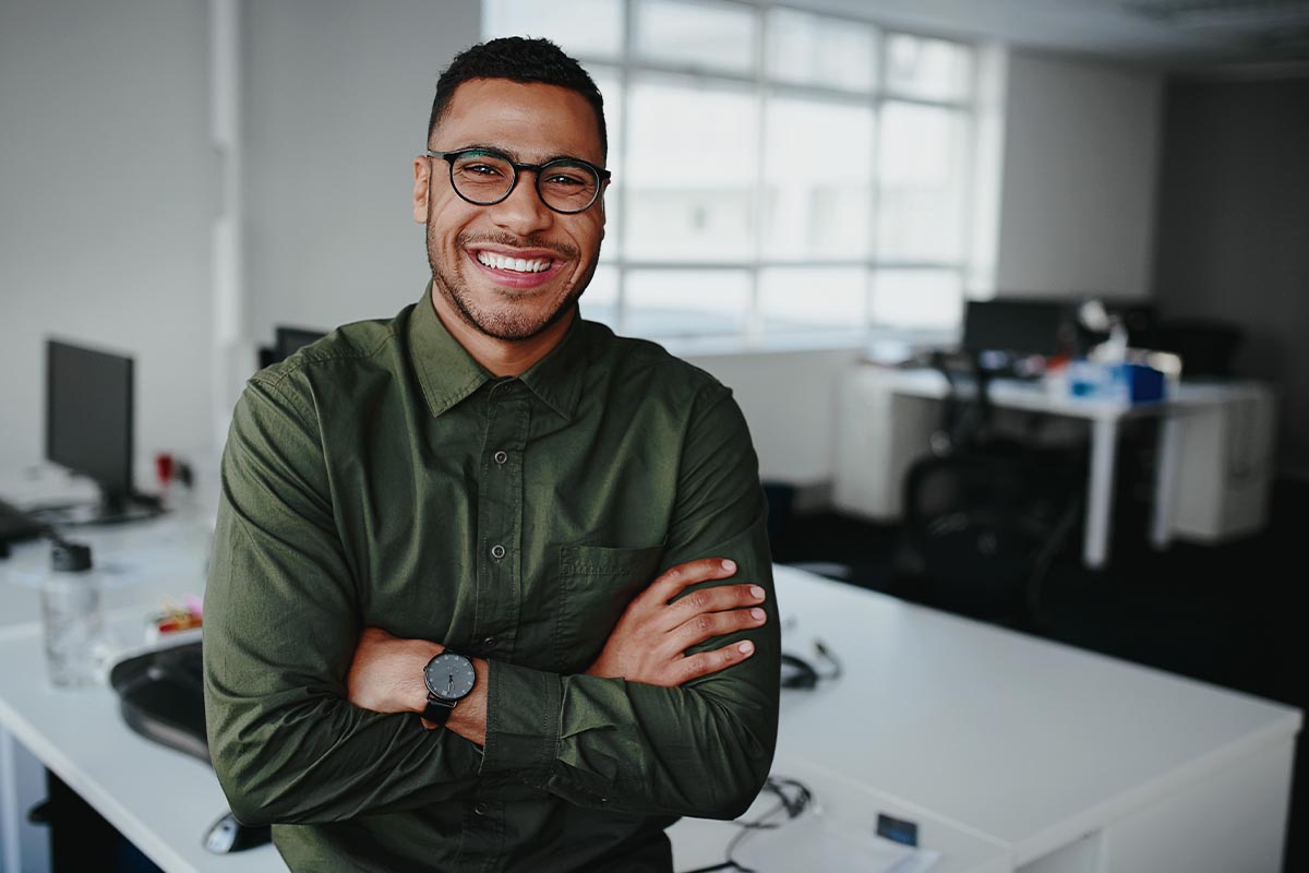 a person smiles after landing a career in behavioral health