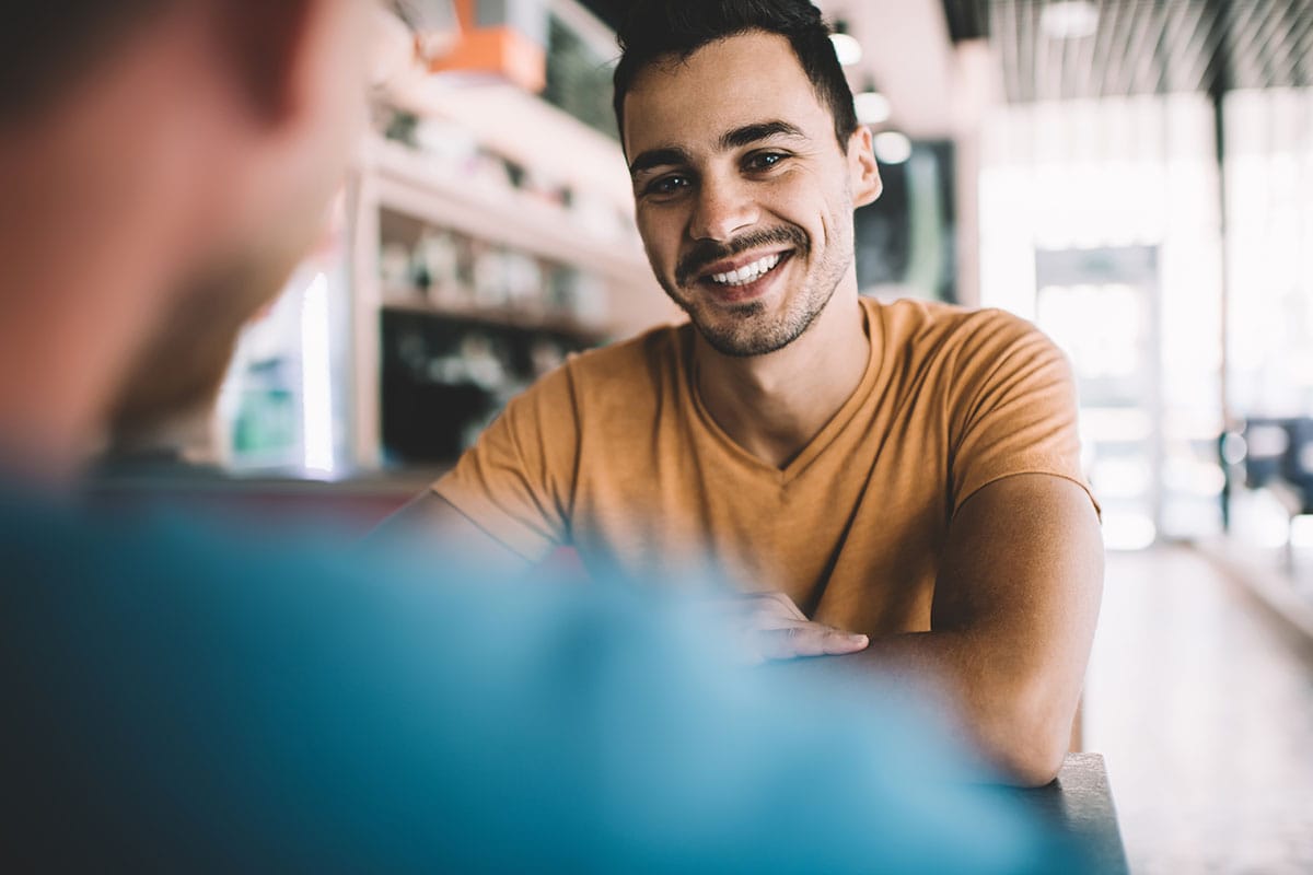 a person speaks to their sponsor after rehab