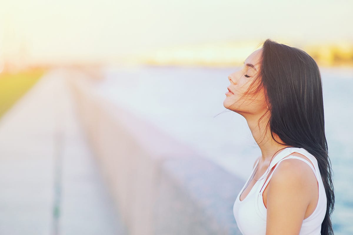 a person breathes deeply one of many stress management techniques