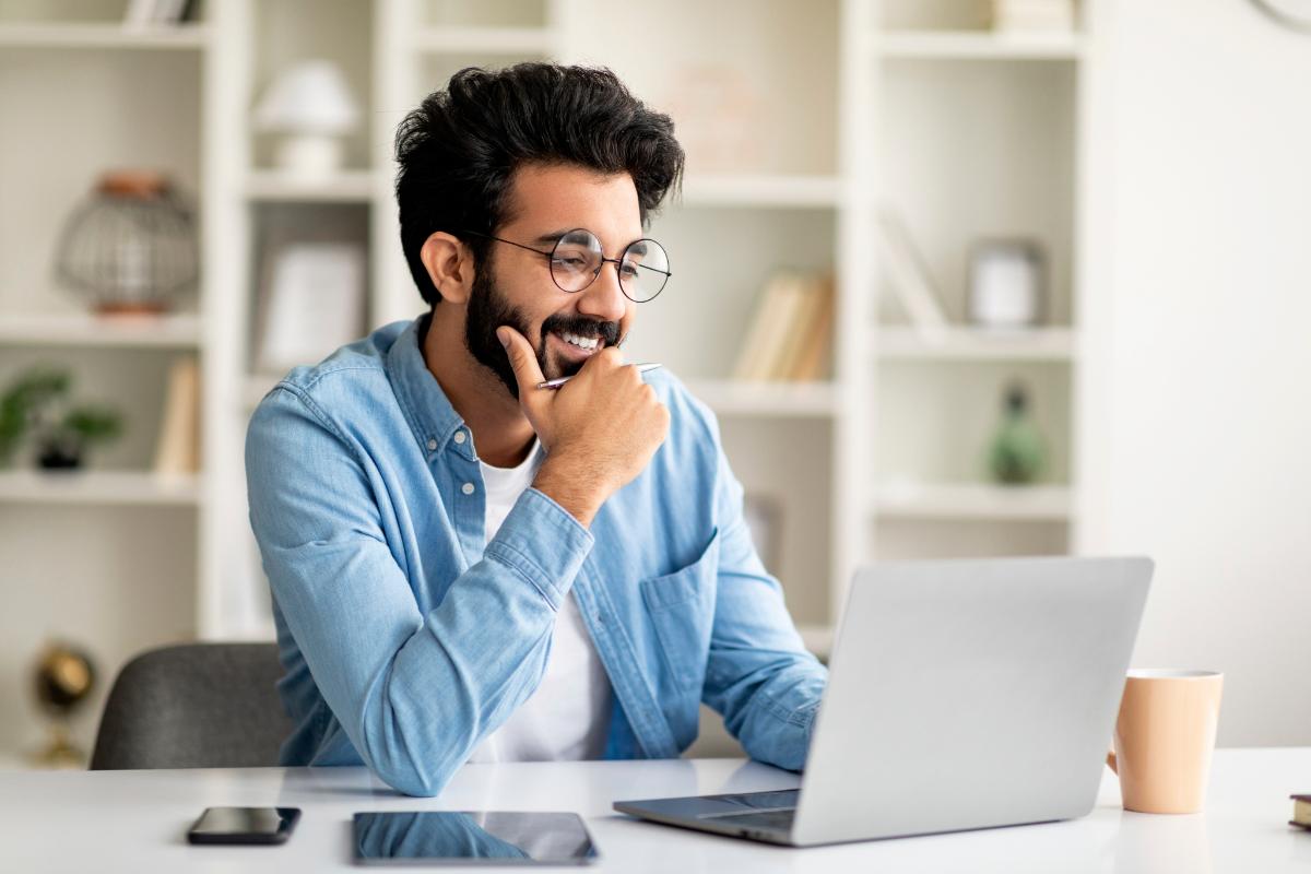 a young man browses mental health jobs in california from his home office