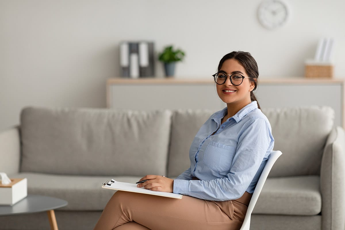 a person smiles after researching behavioral health jobs in texas