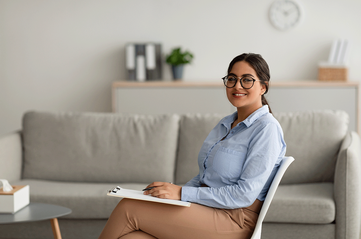 a certified counselor reviews notes in between patients