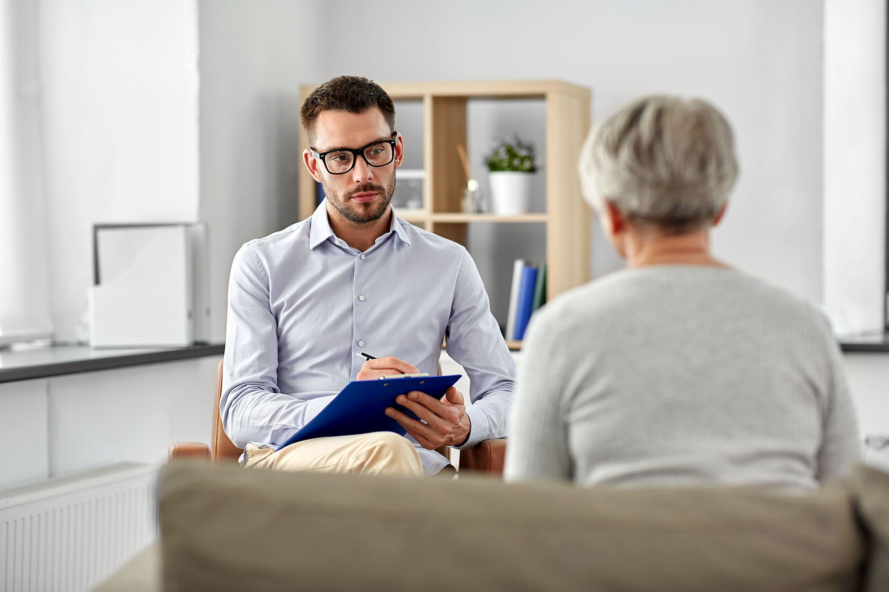 a woman meets with a psychiatrist