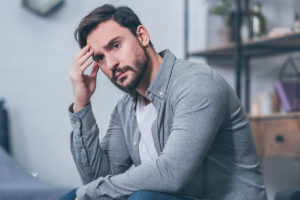 a man worries after being laid off from work
