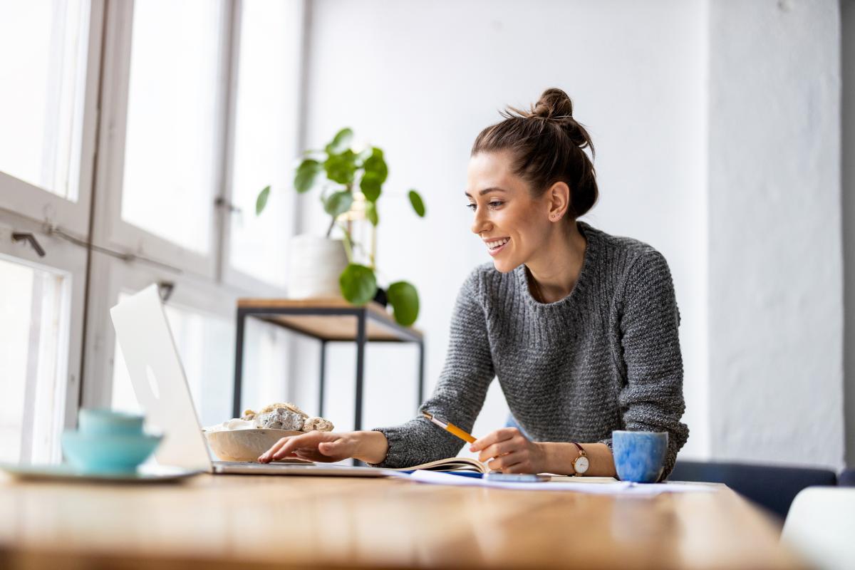 a young woman browses tips for finding her first post grad job