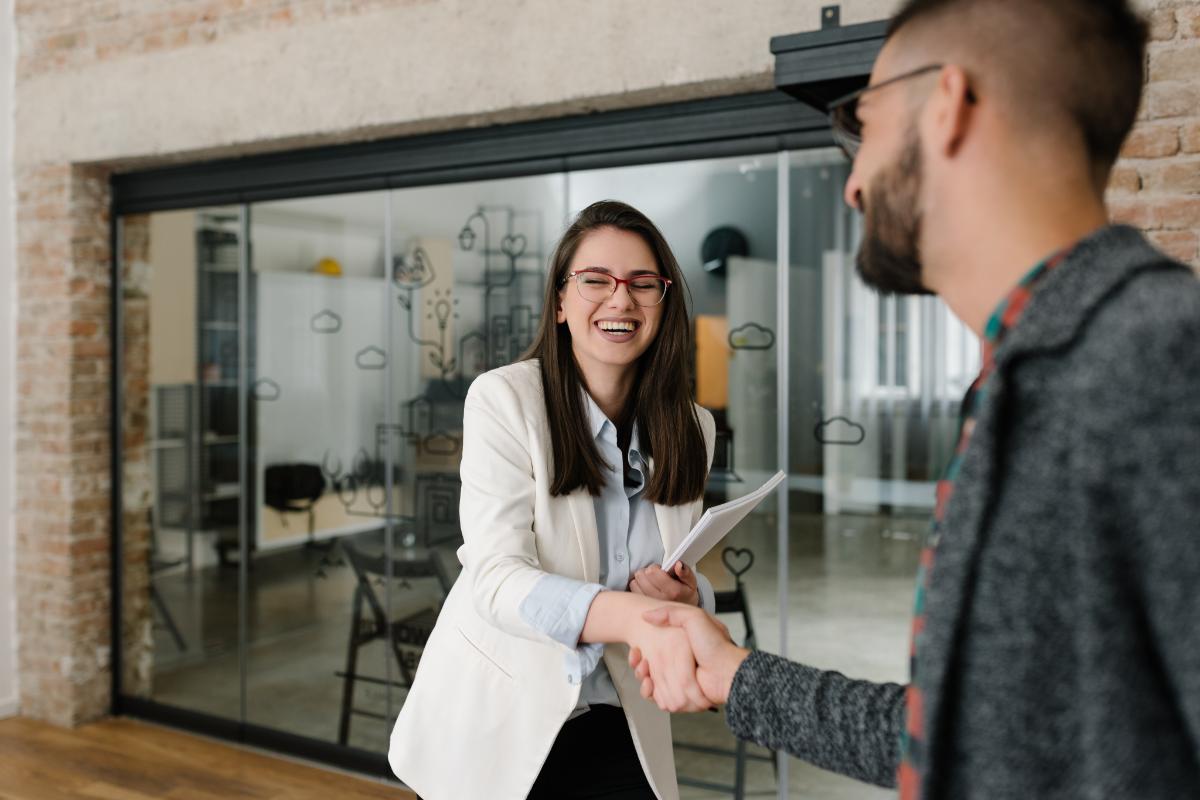 a woman lands a job after interviewing with a successful elevator pitch