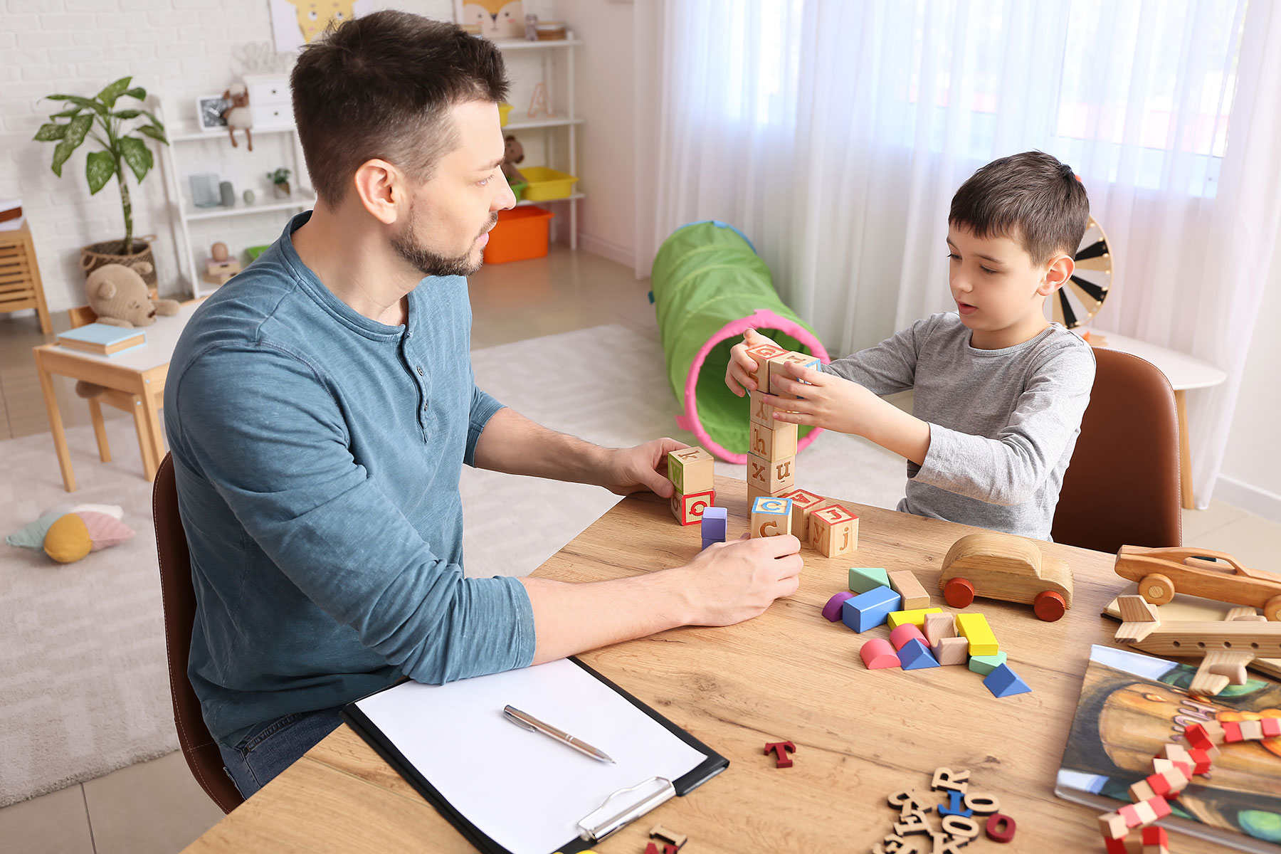 an rbt works with a young client who is on the autism spectrum