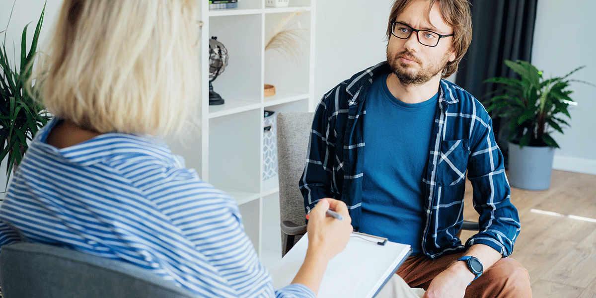 a psychiatric social worker meets with a client in distress