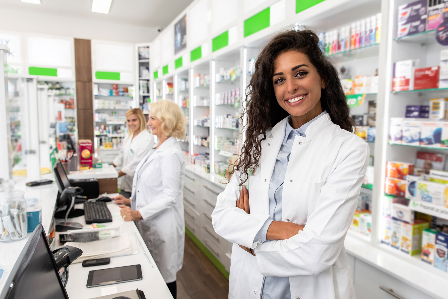 a woman starts her new job as a pharmacist after meeting all the requirements